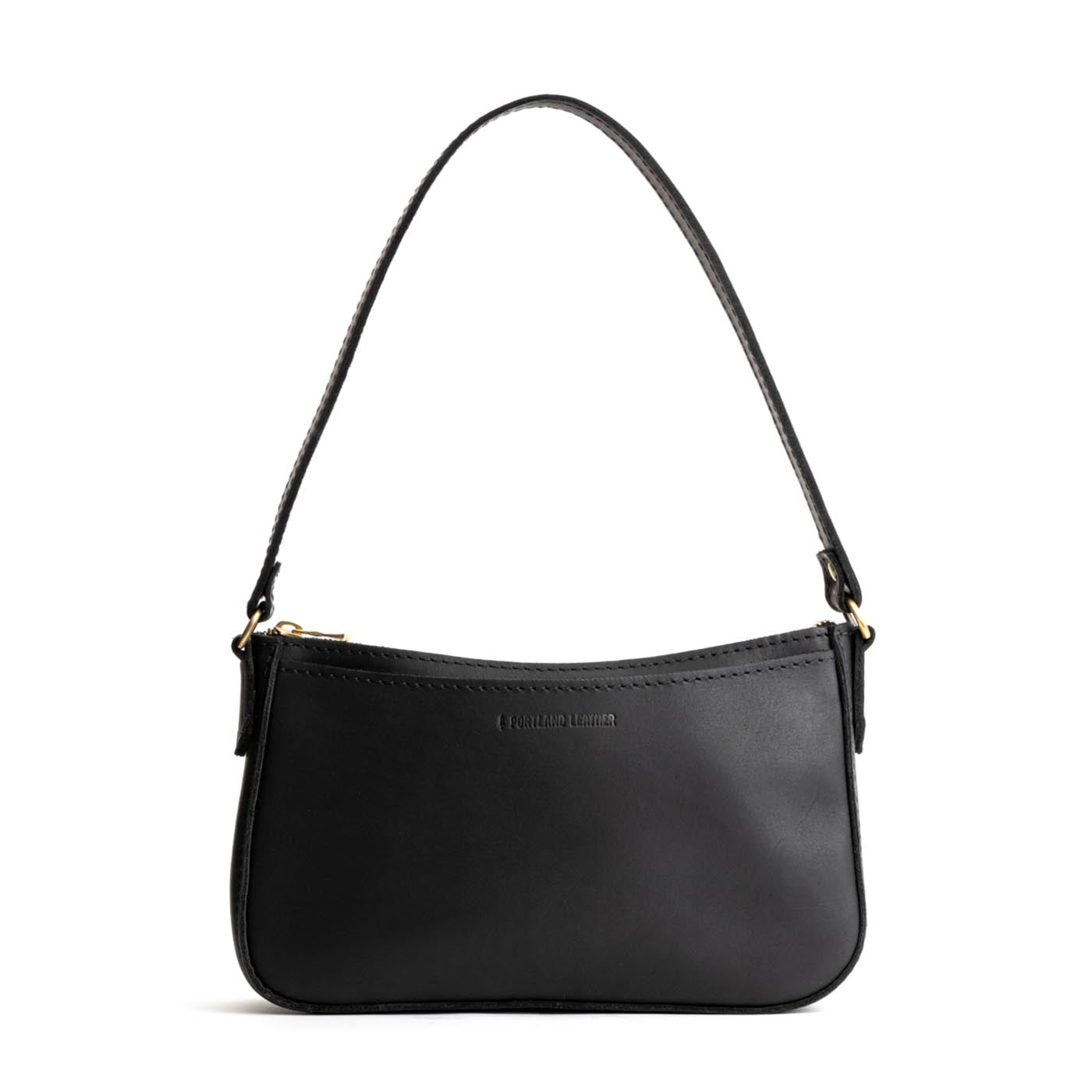  Black | Petite bean shaped shoulder bag with a zipper closure